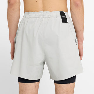 close back view of ciele athletics WRKShort unisex running and technical short from the Lifestyle Edition collection, in light grey color, on a model