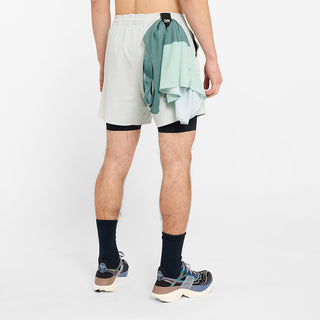 back view of ciele athletics WRKShort unisex running and technical short from the Lifestyle Edition collection, in light grey color, on a model, showing the use of the back loop